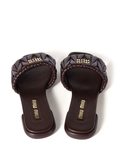 Black quilted leather slippers