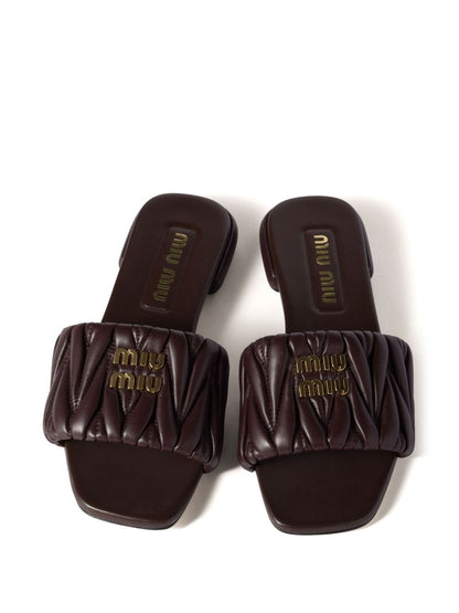 Black quilted leather slippers