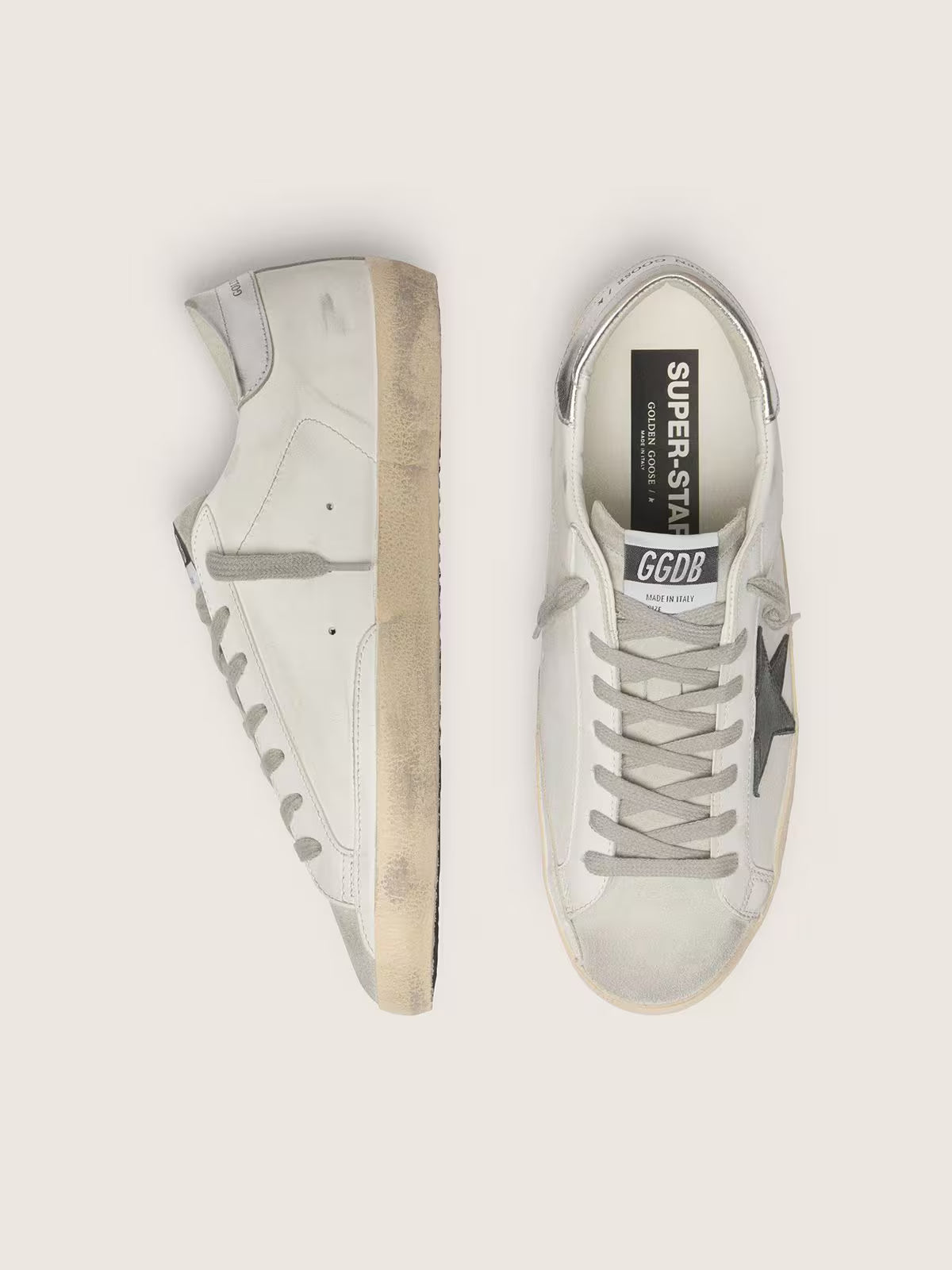 White leather with black nubuck leather star and silver laminated leather heel tab