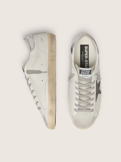 White leather with black nubuck leather star and silver laminated leather heel tab