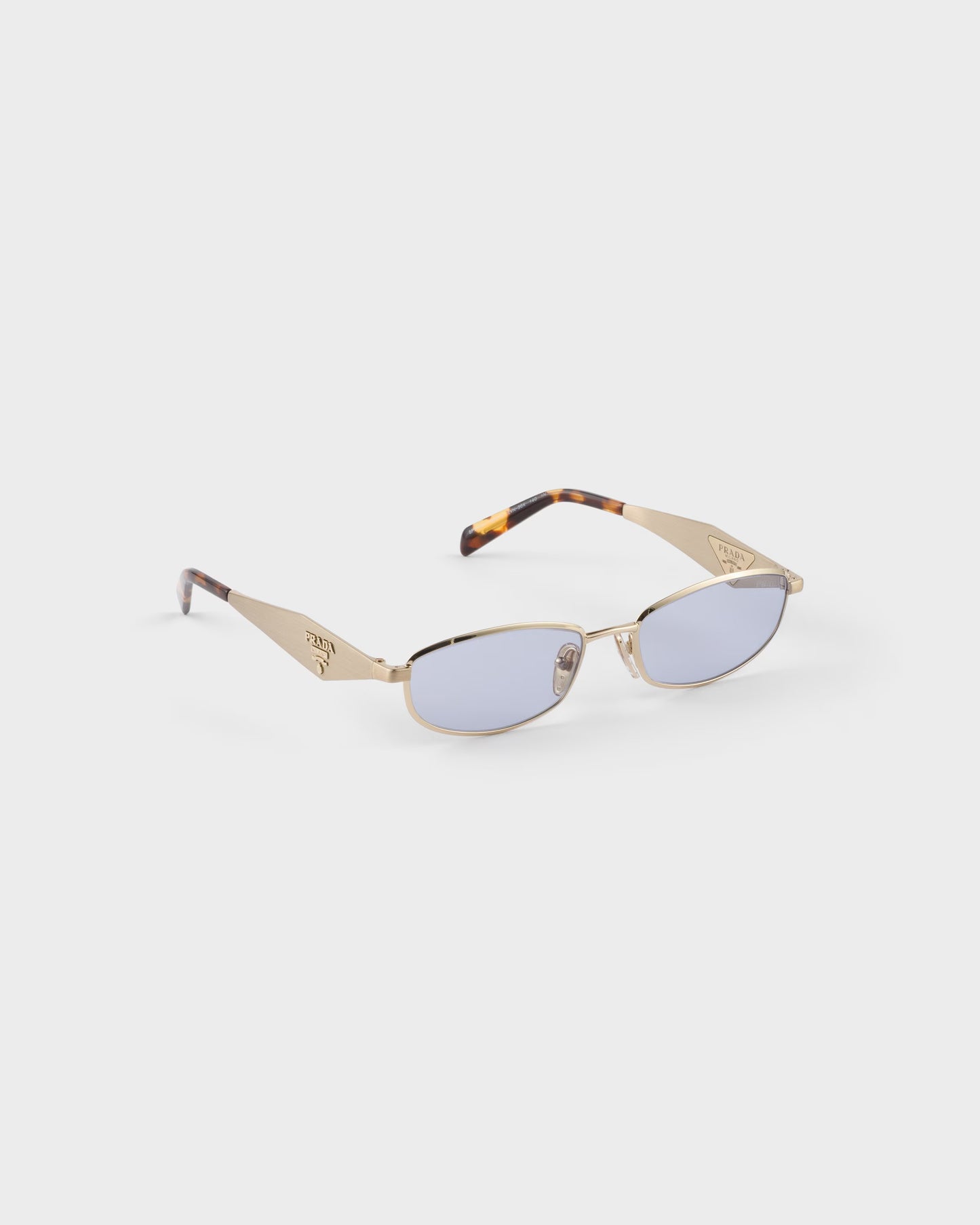 Pale gold-tone oval acetate sunglasses with ultraviolet lenses
