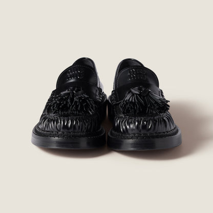 Brushed leather loafers with black tassels