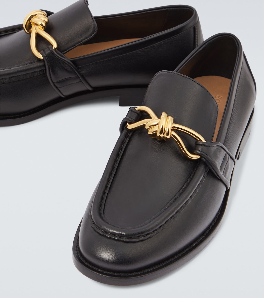 Astaire Knot Loafers in black leather with gold buckle