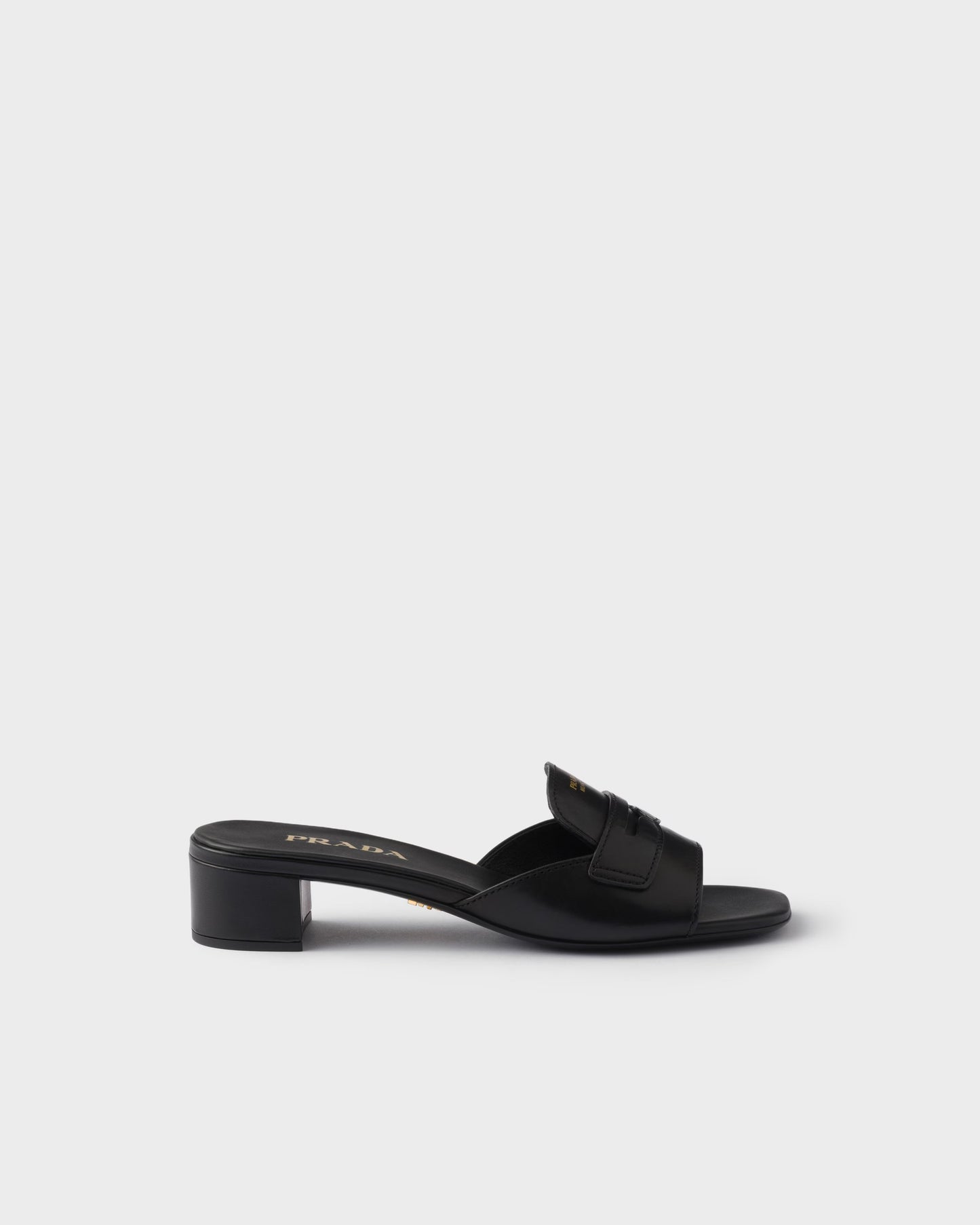 Black leather low-heeled slider sandals
