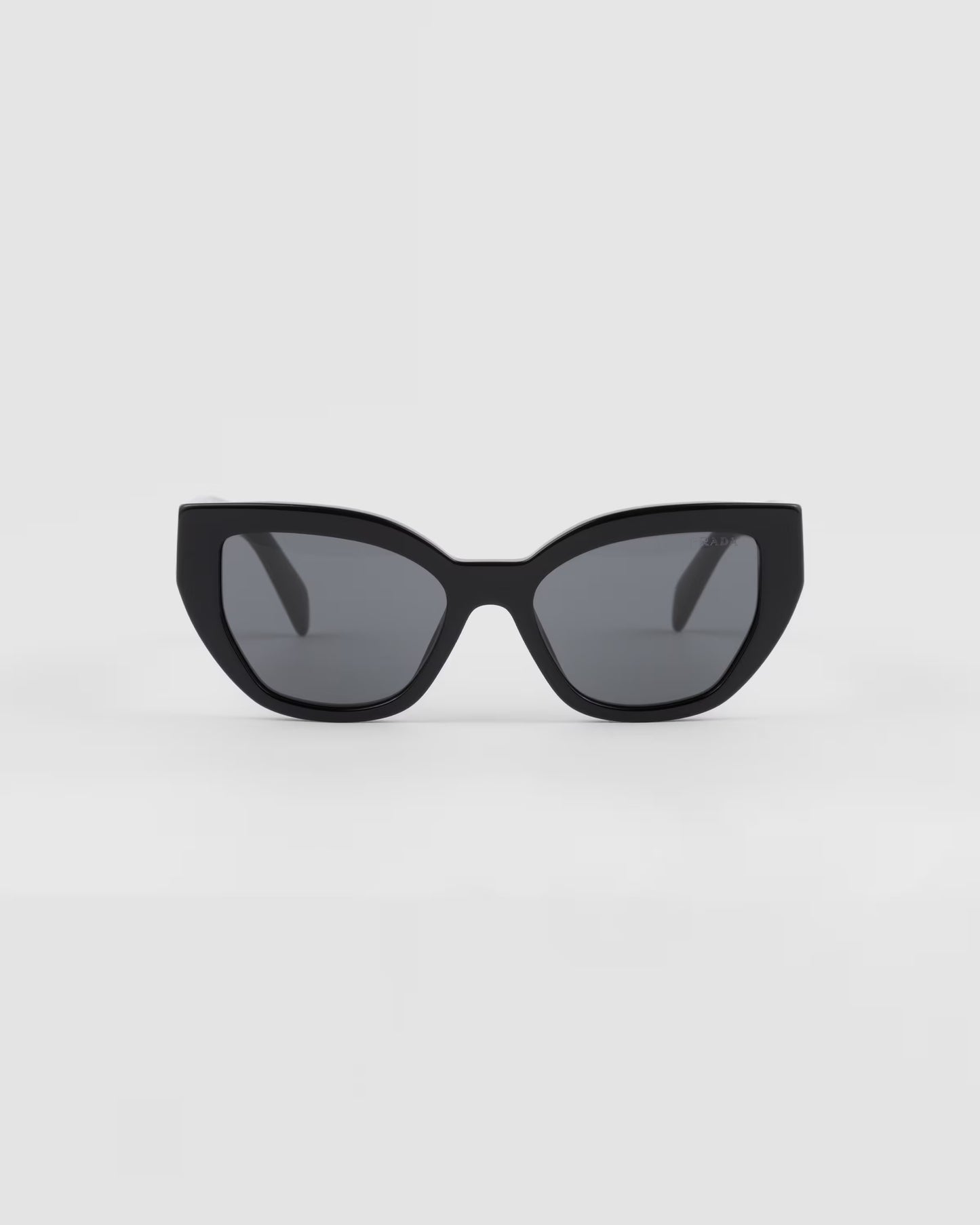 Black cat-eye sunglasses with logo