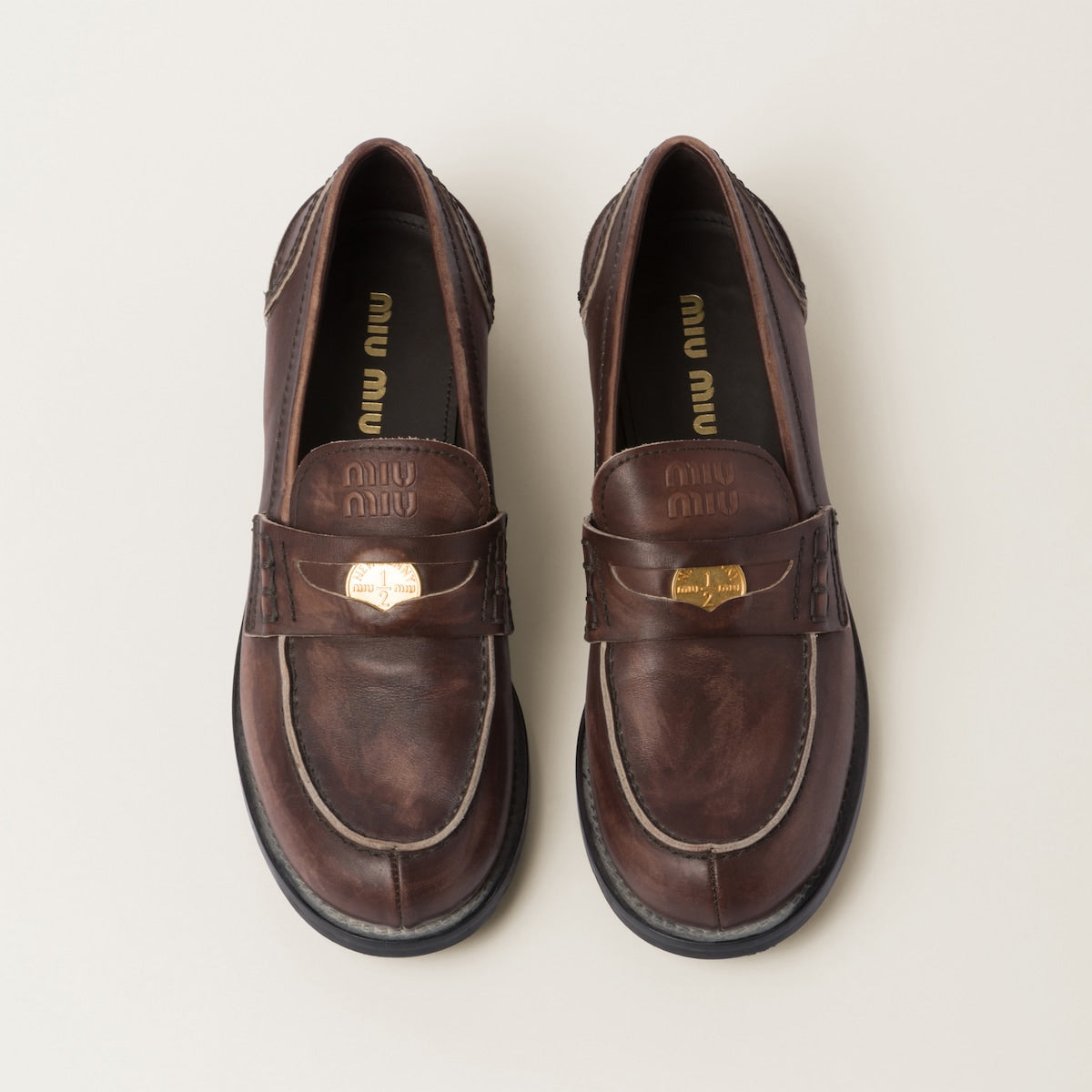 Brown vintage-effect leather loafers