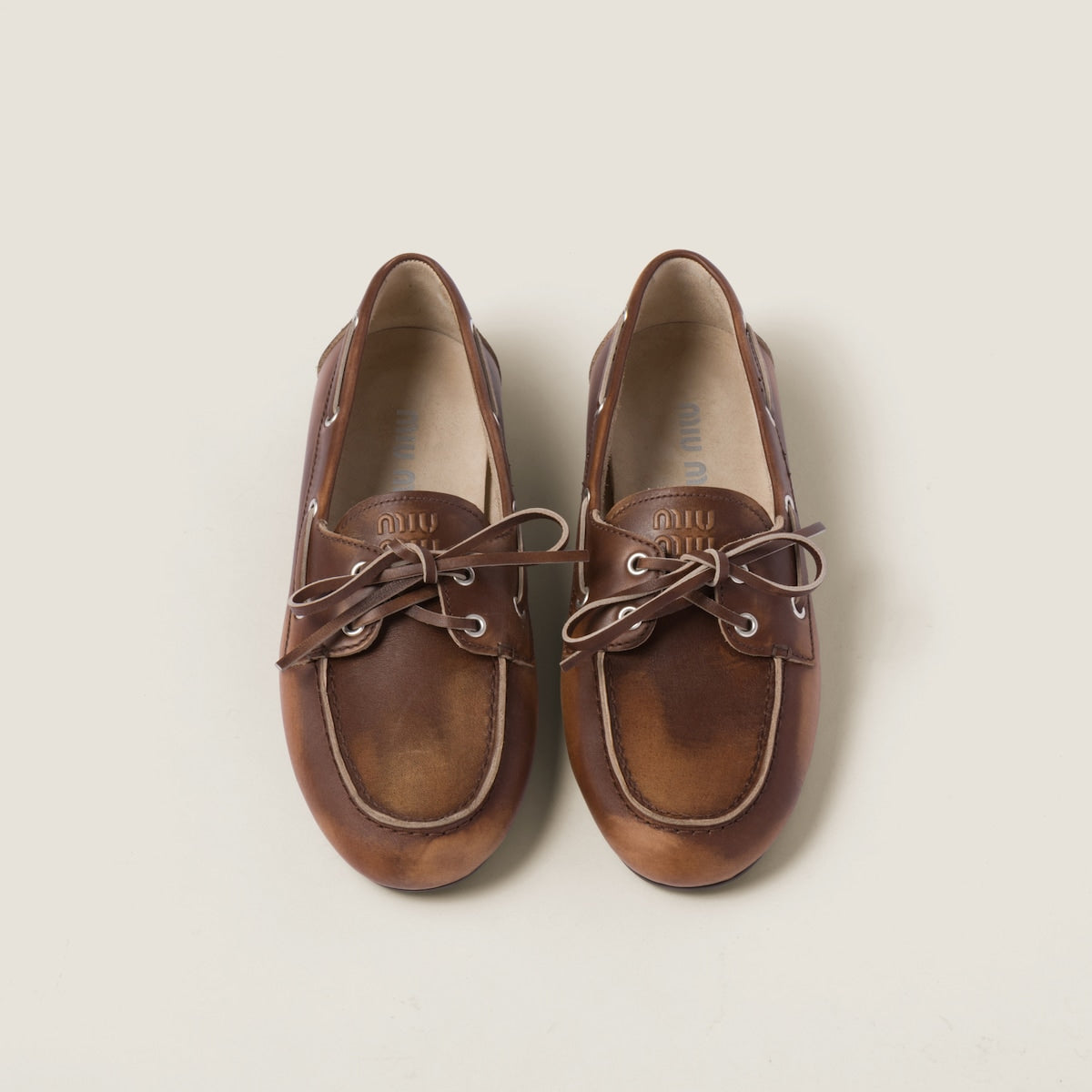 Unlined brown faded leather boat shoes