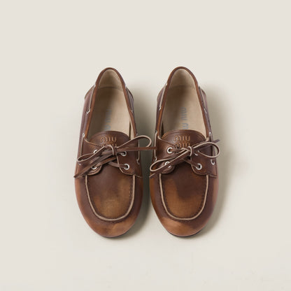 Unlined brown faded leather boat shoes