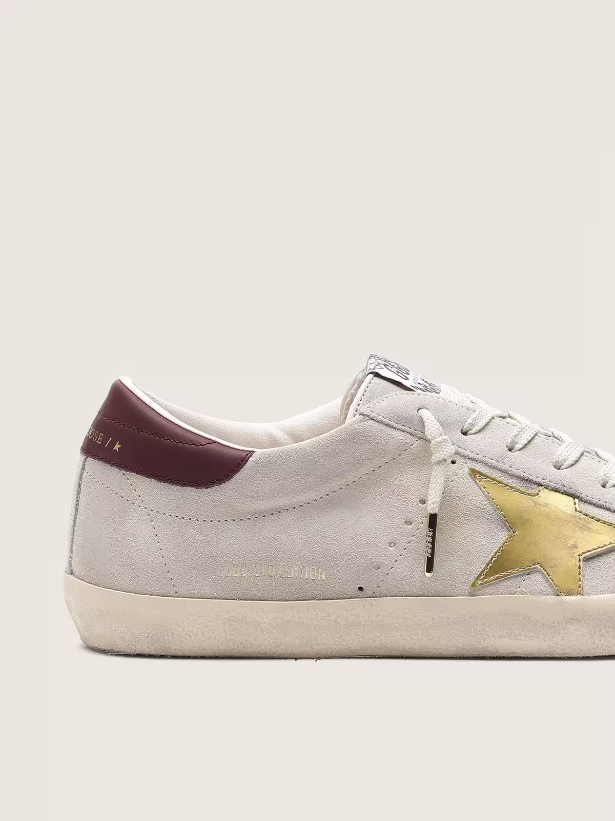 Ivory suede with laminated leather star and leather heel tab