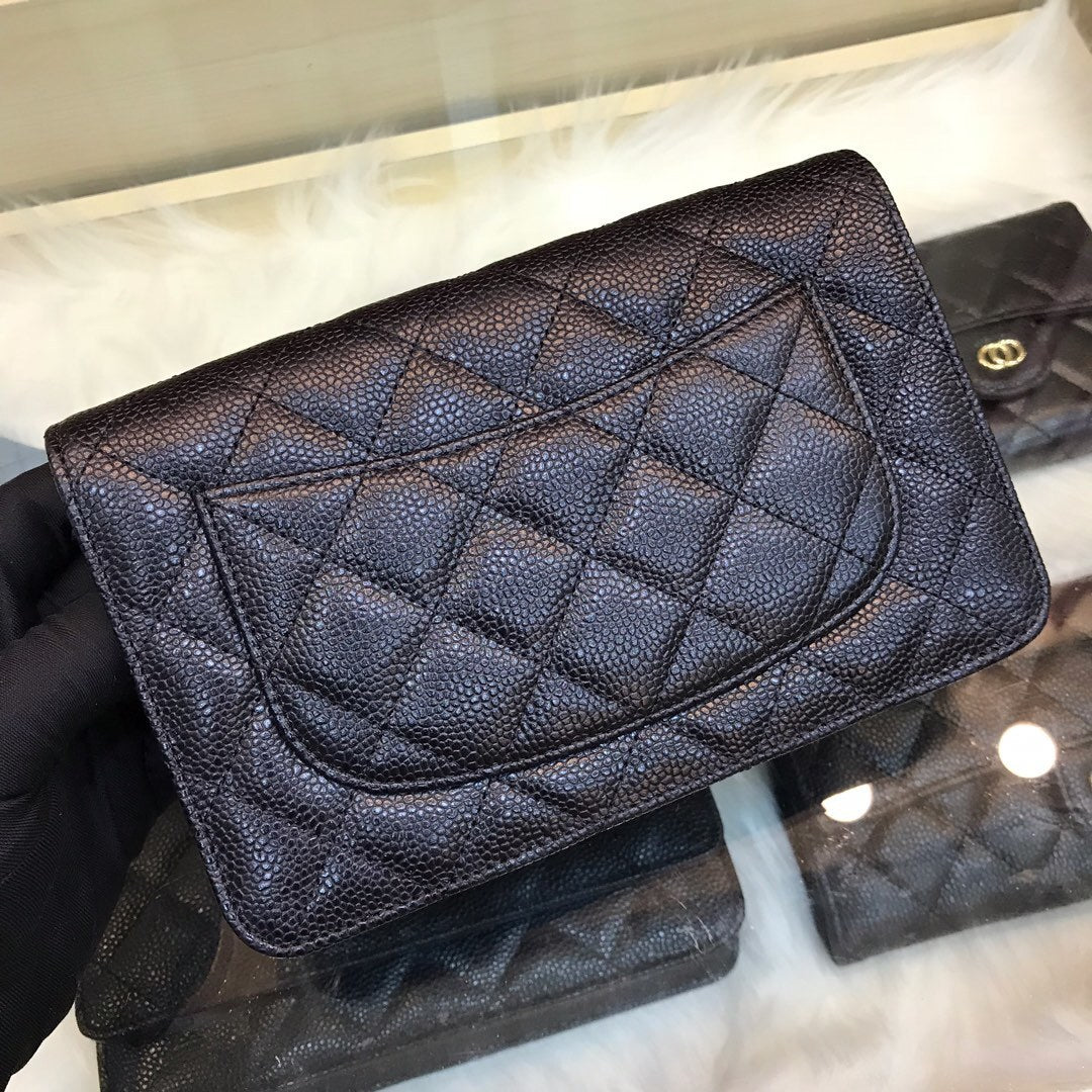 Black wallet with chain and gold logo