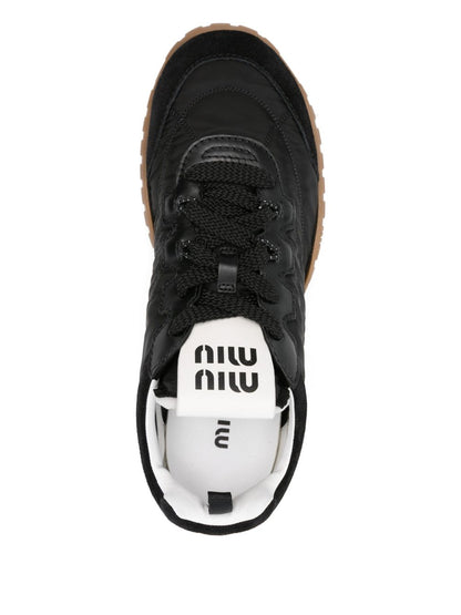 Black panelled trainers