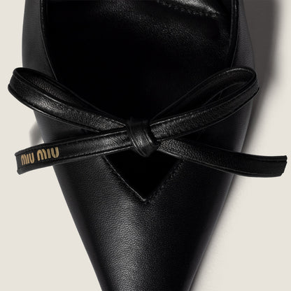 Black leather slingback pumps with bow