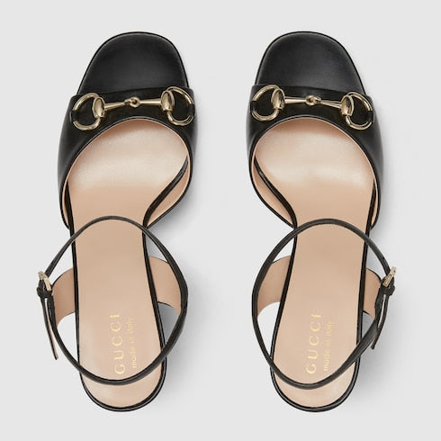 Women's black leather heeled sandal with snaffle