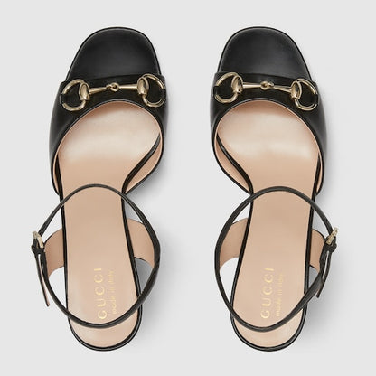 Women's black leather heeled sandal with snaffle