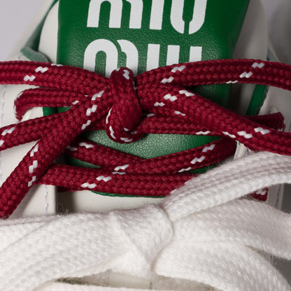 White/green leather sneakers