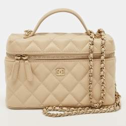 Vanity with shiny beige calfskin sleeve and gilded metal details