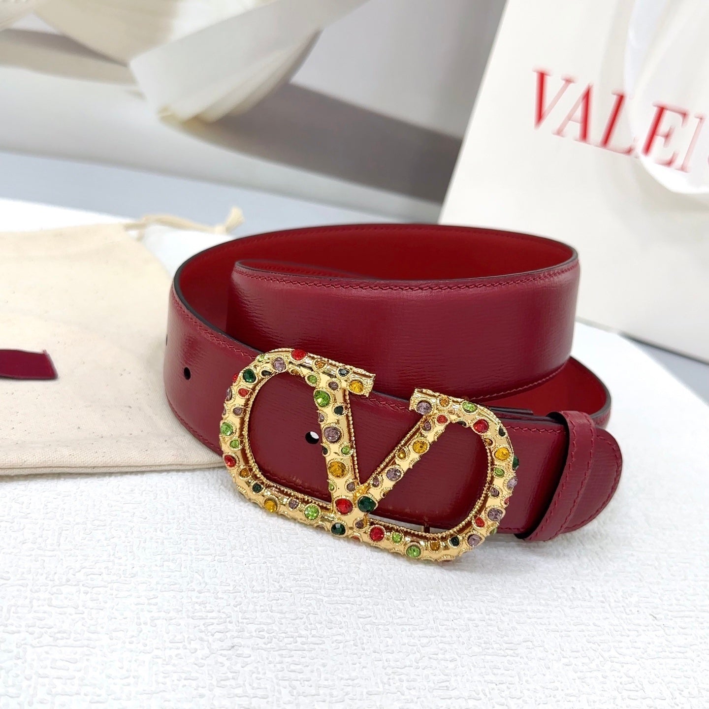 Reversible bordeaux VLogo Signature belt embellished with multicolored Swarovski crystals