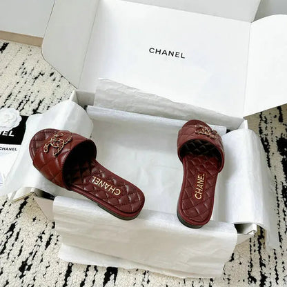 Burgundy quilted leather slides with interwoven C logo