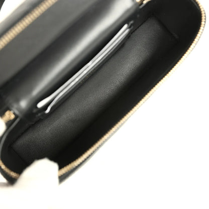 Vanity Case mit Griff oben aus gestepptem schwarzem Lammleder