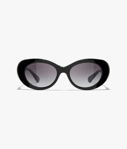 Occhiali da sole ovali in acetato e metallo nero con lenti grigie sfumate