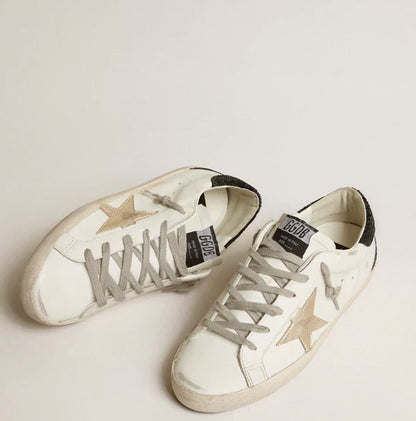 Stella oro e talloncino in glitter nero