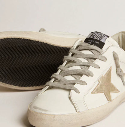 Stella oro e talloncino in glitter nero