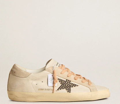 LTD in pelle con stella in suede beige con borchie Swarovski