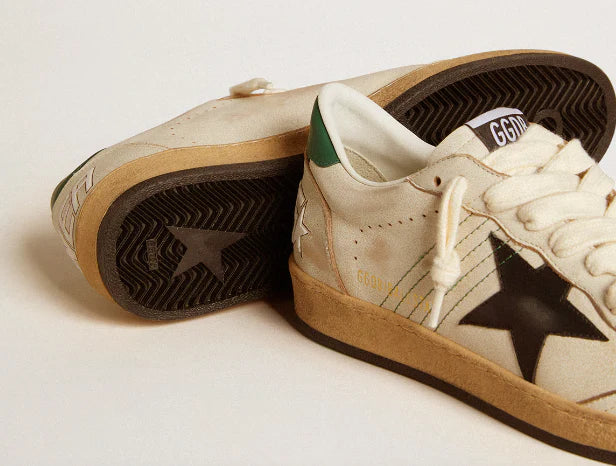 Stella in pelle nera e talloncino in pelle verde