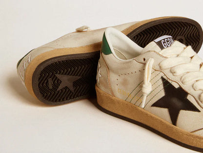 Stella in pelle nera e talloncino in pelle verde